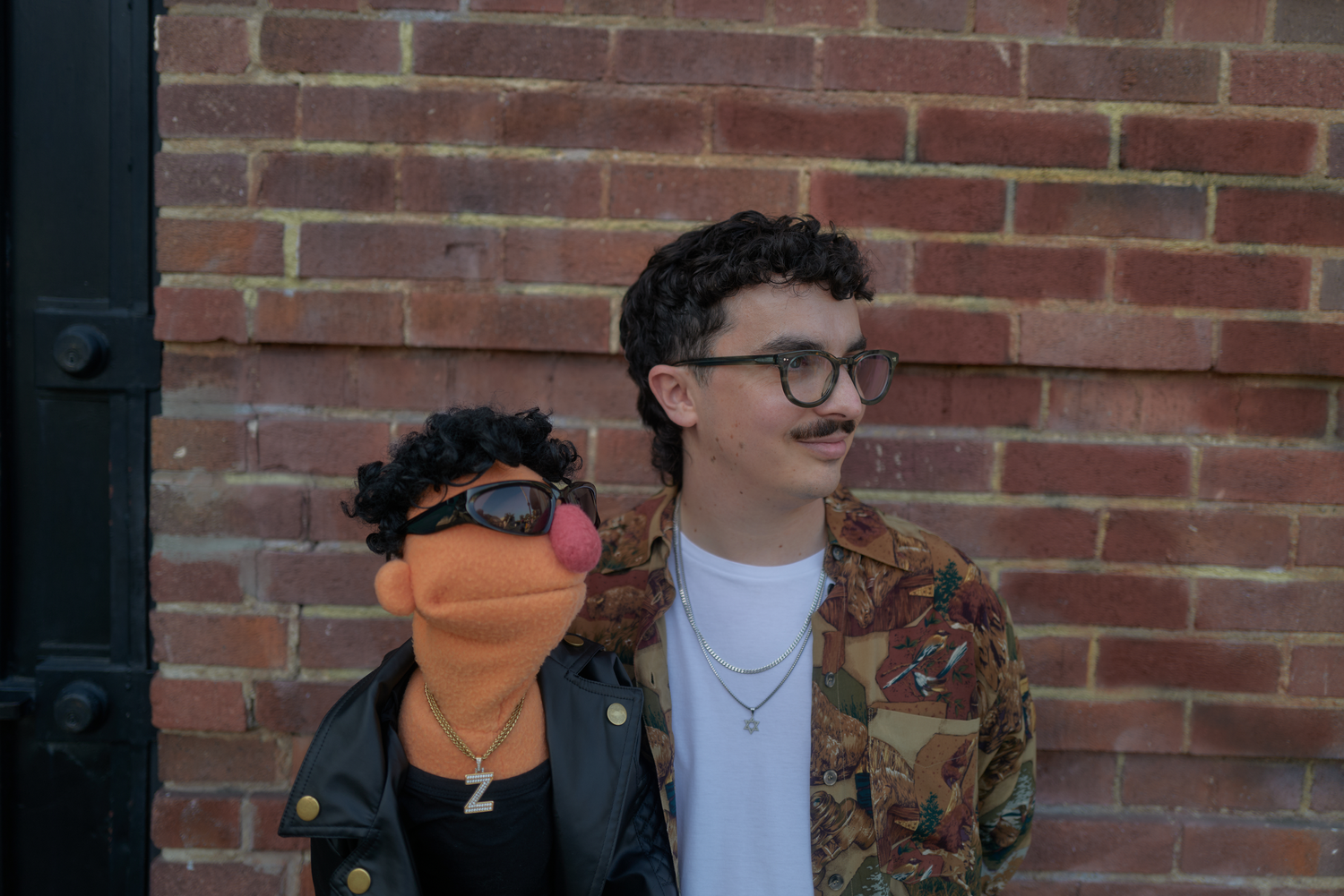 LMNOP and LIL Z at a brick wall